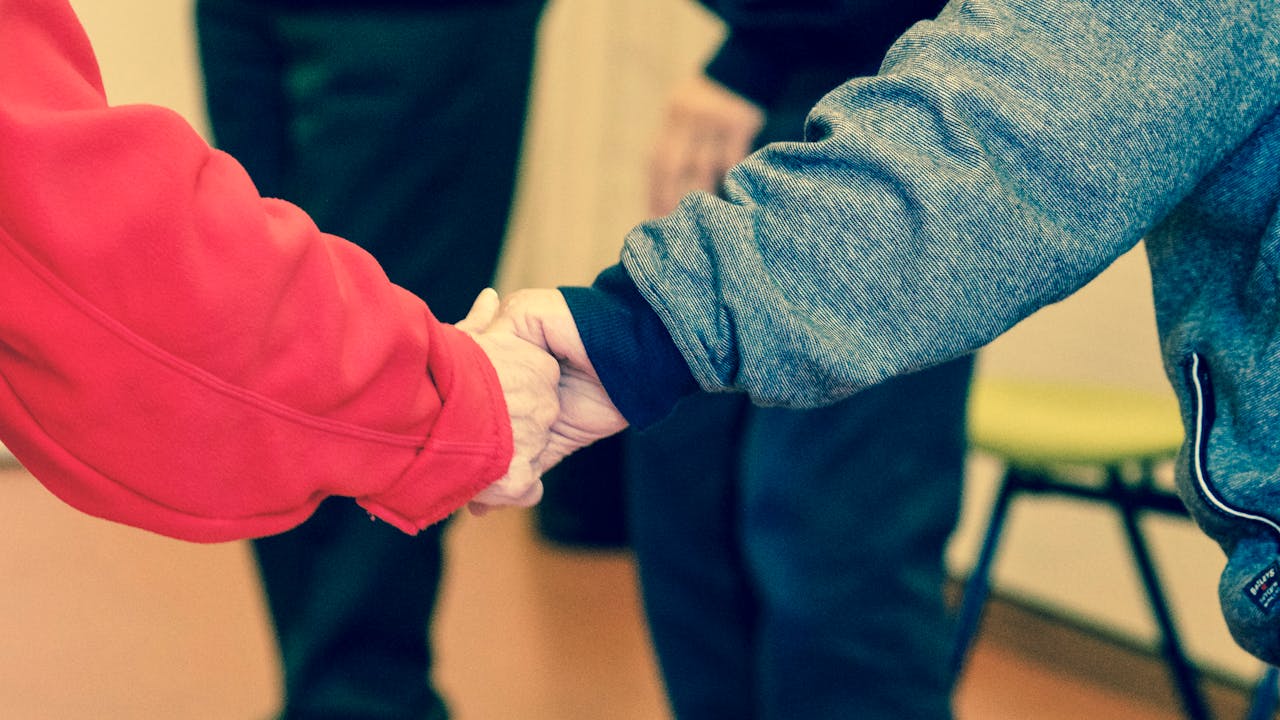 residents holding hands